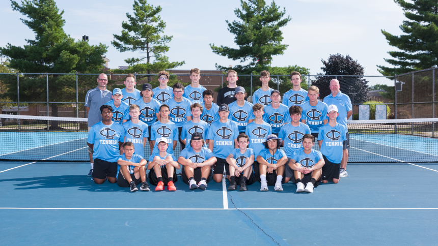 2021 Lansing Catholic High School Boys Tennis Team in their blue uniforms. 