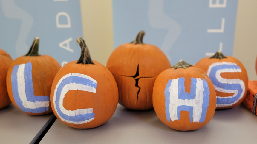 Pumpkins painted with LCHS. The middle has been carved with the LCHS cross logo
