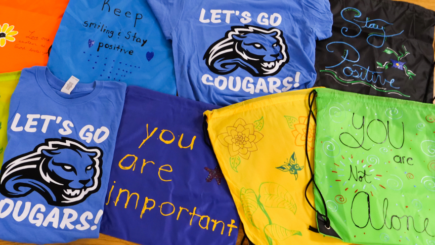 colorful shirts and decorated drawstring bags for supply drive