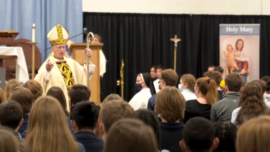 Bishop Earl Boyea speaks to the students of Lansing Catholic High School