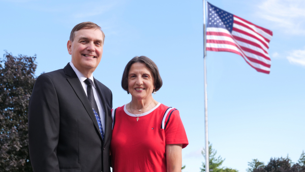 Steven and Joyce Wahoski stand out front by the American flag