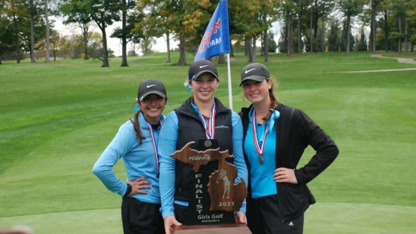 The three seniors hold their Finalist Trophy