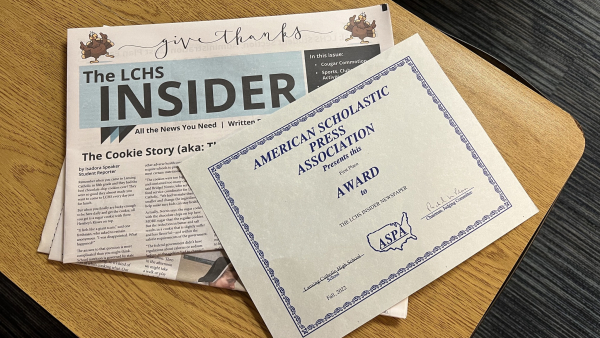 A Photo of The LCHS Insider along with the American Scholastic Press Association Award